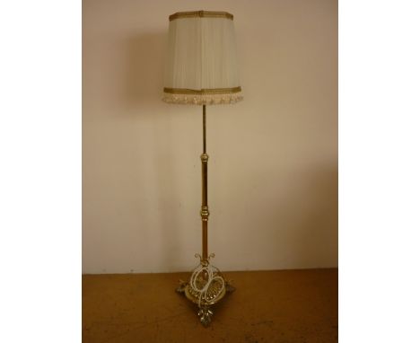 A Victorian brass telescopic standard lamp, converted to electricity, 140 cm to top of burner