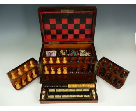 A Victorian rosewood games compendium retailed by E. Baxter of 16 Cockspur Street, London, having a hinged lid and pair of sw