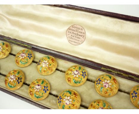 A cased set of twelve early Victorian enamelled yellow-metal dress buttons retailed by Storr and Mortimer, each of two-piece 