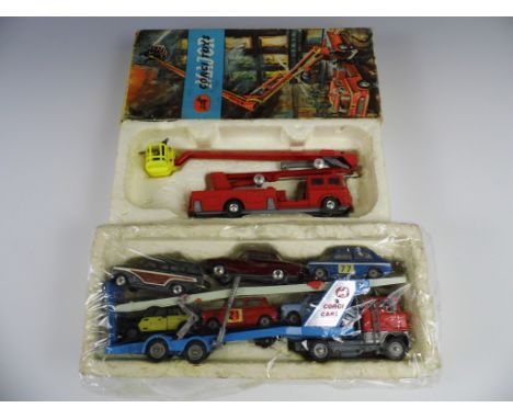 A Corgi Toys Major 1127 Simon Snorkel Fire Engine, together with a Corgi Toys Major car transporter, the latter transporting 