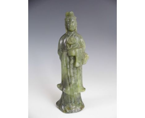 A green jade figure of Guanyin, 15.5 cm, (a/f)