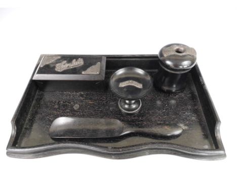 A 1920s silver-mounted ebony dressing table set, comprising tray, trinket box, hair tidy, shoe horn and ring stand