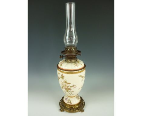 A late 19th Century ceramic and brass oil lamp, having a Royal Worcester lobed-shouldered ovoid reservoir and stand, decorate