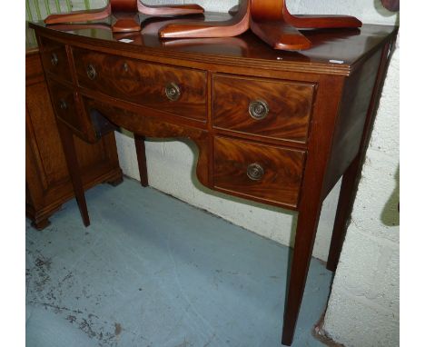 Mahogany bow front serving table with central draw flanked by four short drawers 