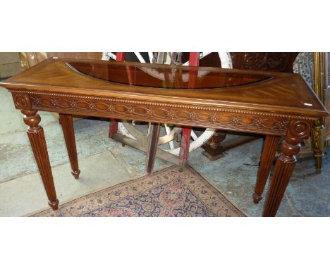 Modern oak hall table with inset glass panel on tapering fluted supports with carved detail 