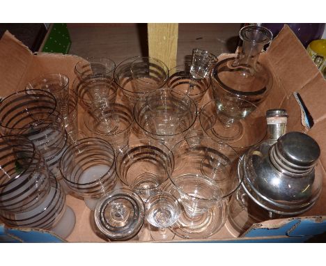 Glass cocktail set with various size glasses, decanter etc