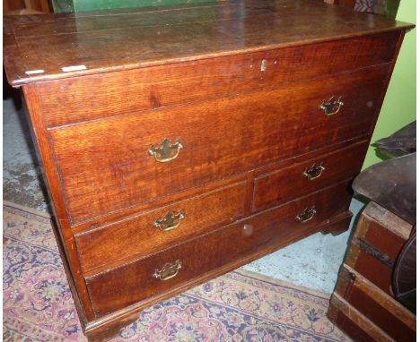 19th C oak mule chest with hinged top above false drawer and two short above single long drawers on raised bracket feet 