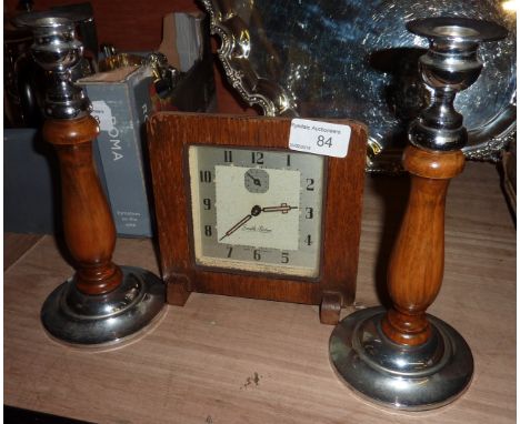 Smiths alarm clock and a pair of wooden and chrome candlesticks