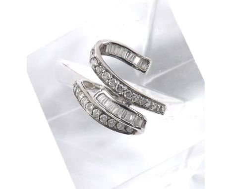 18k white gold diamond snake design twist ring, with channels of baguette and round brilliant-cut diamonds, 3.6gm, ring size 
