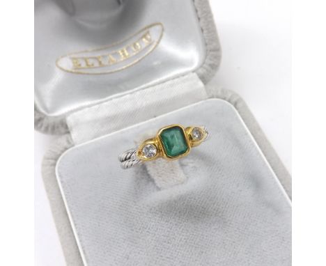 18ct white gold emerald and two stone diamond set ring, with double rope twist shank, 4.3gm, ring size L; with box