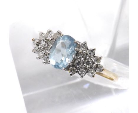 Aquamarine and diamond 9ct cluster ring, the aquamarine estimated 0.71ct approx, in a surround of round brilliant-cut diamond
