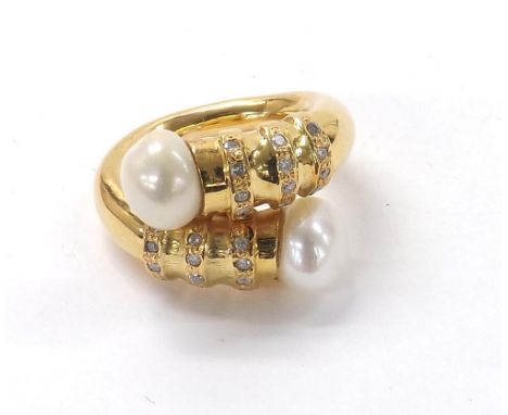 Freshwater pearl and diamond cross-over design ring, with two pearl terminals each 9mm, with six bands of diamonds each consi