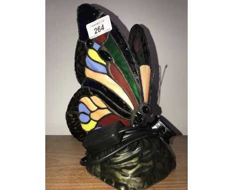 A TIFFANY STYLE LAMP OF A BUTTERFLY