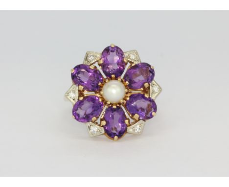 A 14ct yellow gold (stamped 14k) ring set with oval cut amethysts, diamonds and a cultured pearl, (N.5).