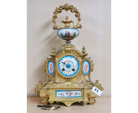 A 19th C. French gilt metal and porcelain mantle clock, H. 39cm.