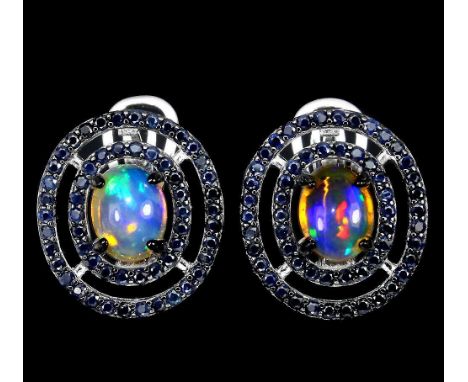 A pair of 925 silver cluster earrings set with cabochon cut opal and two rows of sapphires, L. 2.8cm.