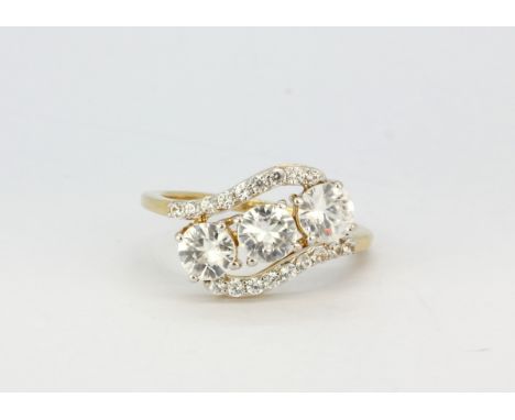 A 9ct yellow gold (stamped 9k) crossover ring set with white stones (N.5), approx. 2.8gr.