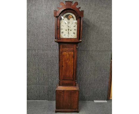 An oak cased eight day English long cased clock with moon dial by Stubbington of Gosport. The rear of the dial is impressed w