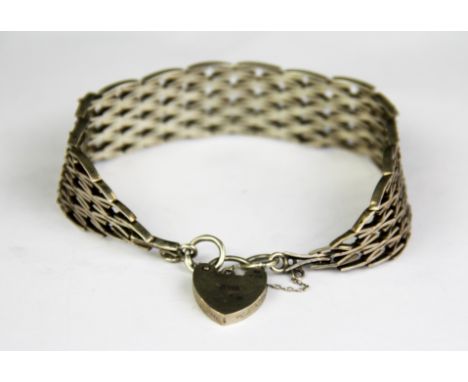 A heavy hallmarked silver gate style bracelet.