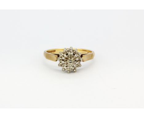 A hallmarked 9ct yellow gold diamond set cluster ring, (P.5), approx. 3.1gr.