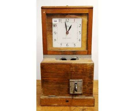 A National Time Recorder clocking in clock, H. 69cm.