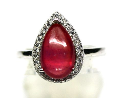 A 925 silver ring set with pear cabochon cut ruby and white stones, (O).