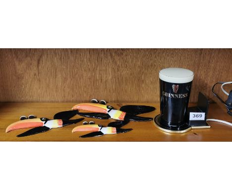 A set of three Carltonware Guinness advertising flying toucans and a Guinness bar light.