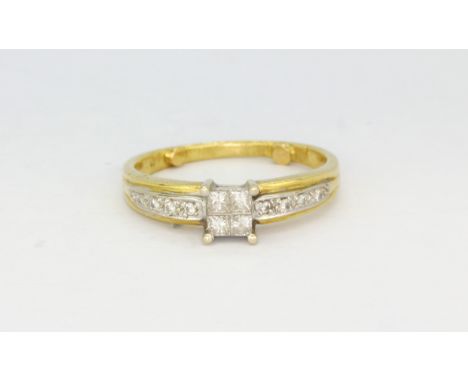 A yellow and white metal (tested minimum 9ct gold) solitaire ring set with princess cut diamonds and diamond set shoulders, (