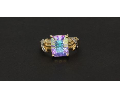 A 14ct yellow gold (stamped 14k) ring set with a large square cut mystic topaz and diamond set shoulders, (O).