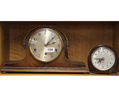 A 1930's chiming oak mantel clock, H. 23cm, together with a bakelite mantle clock.