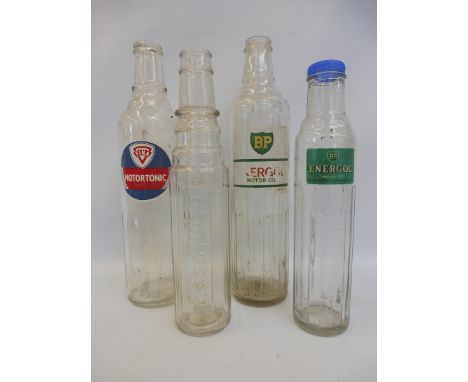 Four glass oil bottles including Fina Motortonic and BP Energol.
