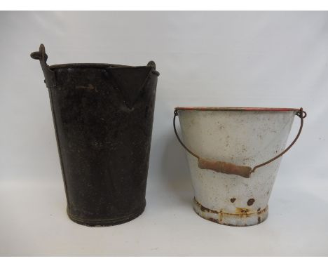 A heavy duty bucket, with pointed spout, possibly railway related and a second bucket in enamel.