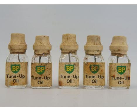 Five miniature BP Tune-Up Oil glass bottles for Scalextric or Hornby. 