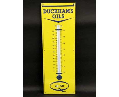 A Duckham's Oils enamel thermometer in near mint condition, 12 x 36". 