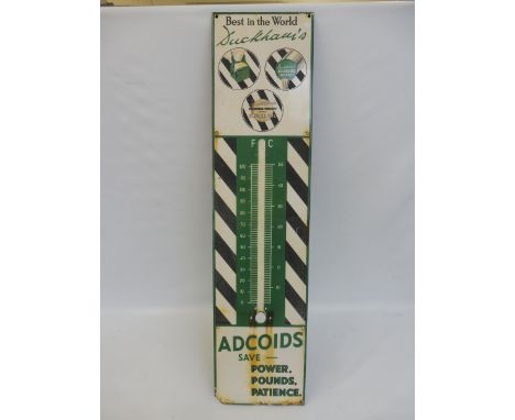 A Duckham's Adcoids black and white enamel thermometer, lacking tube and faded.