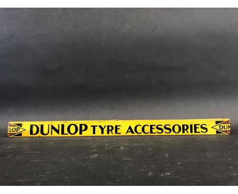 A Dunlop Tyre Accessories shelf strip in good condition.