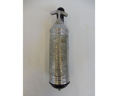 A Desmo chrome plated fire extinguisher on a bracket.