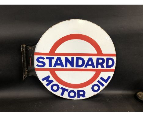 A Standard Motor Oil circular double sided enamel sign with hanging flange, stamped to the flange 'Japy Beautor' 21 3/4 x 19 