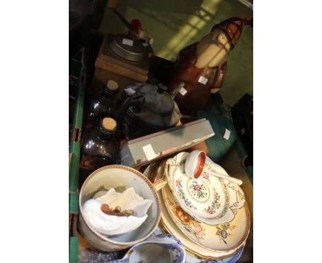 A box containing a large ceramic Santa Claus, coffee grinder etc