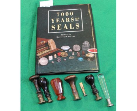 An agate seal, bears "M" monogram, together with various other seals and a book "7000 years of seals" edited by Dominique Col