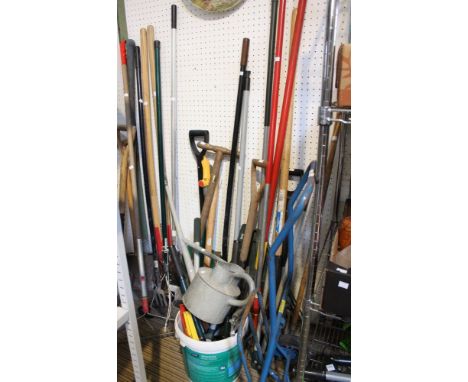 A wide selection of garden tools including wooden handled examples, sack truck etc