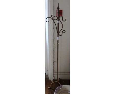 A metal garden freestanding bracket on tripod legs