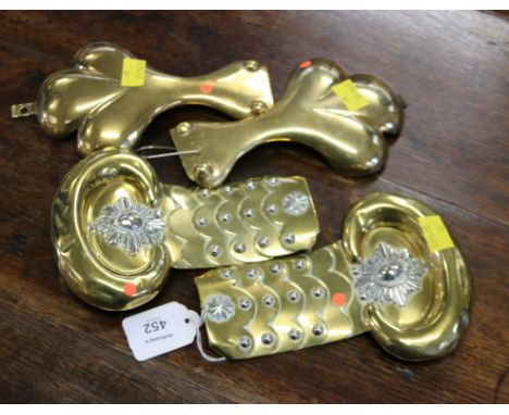 A pair of brass and white metal epaulettes, decorated with Garter crest and rivetted scales, and a pair of trefoil re-cast ep
