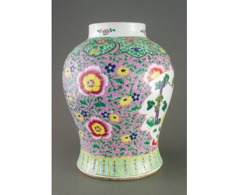A large 19th century Chinese famille rose baluster vase, painted with flowers and scrolls in colours on a pink enamel ground 