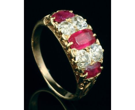 A Victorian seven stone half hoop ruby and diamond ring, the four mixed old brilliant cut diamonds and three oval cut rubies 