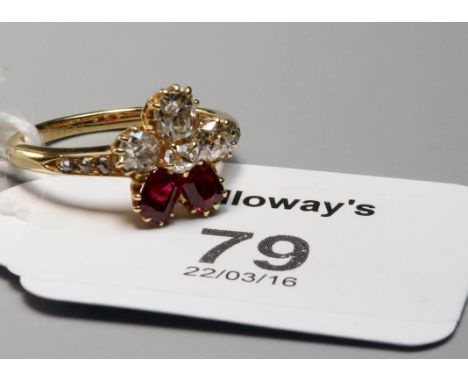 A ruby and diamond cluster ring, set with four mixed old cut diamonds and two cushion cut rubies, with tapered rose diamond s