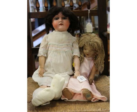 A Max Handwerk bisque head doll, with sleeping eyes, open mouth, composition body and limbs, head mould number 283/29, togeth