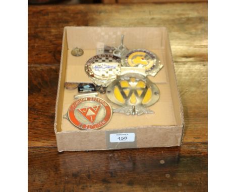 An East African Automobile Association radiator badge, a Taunton Motoring Club badge, an I.A.M. badge, A.A. badge and seven m