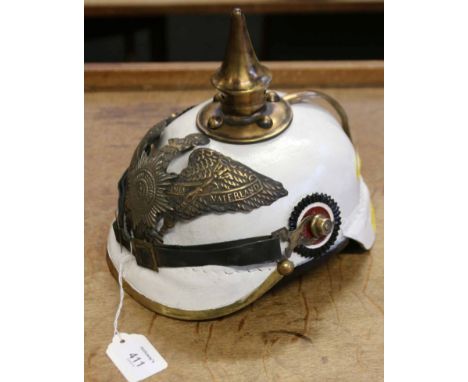 A brass mounted, shaped leather re-enactment pickelhaube helmet, with white painted finish and spear form spike