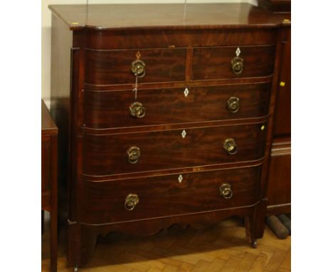 A 19th century mahogany North Country chest of break bow front form, having two short and three graduated long drawers, with 